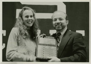 Joan Carey receiving Scholar-Athlete Plaque, 1983
