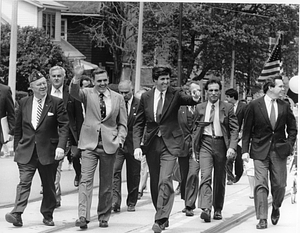 Mayor Raymond L. Flynn and Senate candidate John Kerry marching in a parade with other men