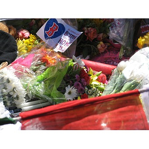 Flowers left at makeshift Boston Marathon memorial on Boylston Street