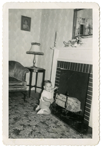 Robert Mello in front of fireplace
