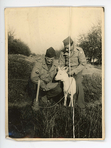 View of Murray Rosenblum and unidentified solider with goat