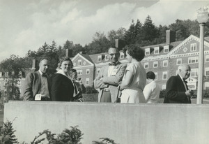 Class of 1948 alumni chatting near Thatcher House