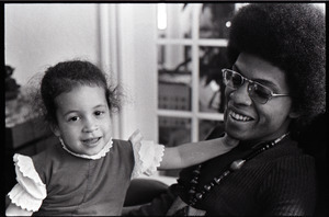 Herbie Hancock with daughter Jessica in lap - Digital Commonwealth