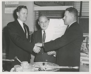 William C. Gorthy and an unidentified man present the thumbs up award