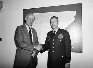 Congressman John W. Olver (left) shaking hands with Raymond F. Rees, Director of the Army National Guard, National Guard Bureau