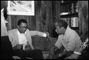 James Baldwin (right) talking with David Graham Du Bois, at the book party for Robert H. Abel
