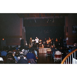 View of the audience and the band on stage at the Jorge Hernandez Cultural Center.