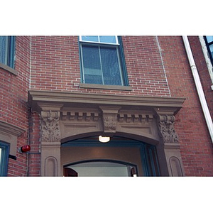 Brownstone molding above the entrance door to Residencia Betances.