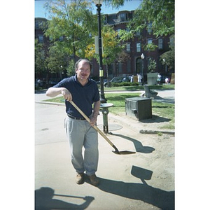David Cortiella wielding a shovel.