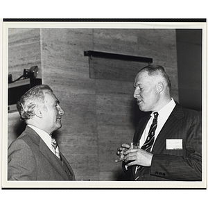 John W. Sears, at right, talks to an unidentified man