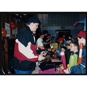 Boys exchange toy guns for clothing and other toys during a gun awareness event