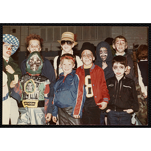 Boys in Halloween costumes pose for a group shot