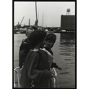 A Group of boys standing at the bow of a boat