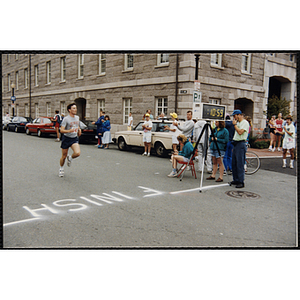 A runner approaches the finish line during the Battle of Bunker Hill Road Race