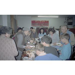 Guests eating during a Chinese Progressive Association anniversary event