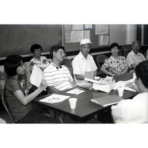 CPA members talking at a Workers' Center meeting