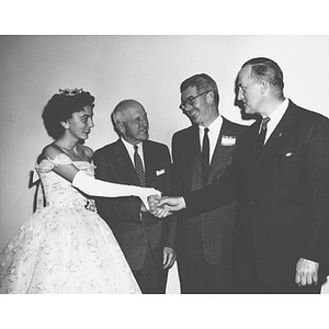 VIPs shake hands at the 1958 Alumni Homecoming Dinner