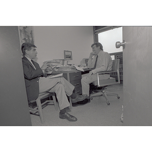 Former Massachusetts Governor Michael Dukakis, left, speaks with Political Science Department professor Bruce Wallin