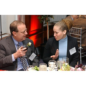 Two guests converse at The National Council Dinner