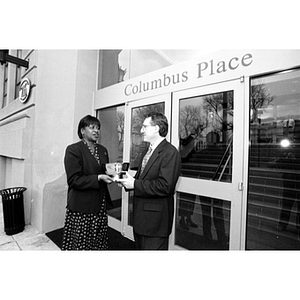 Ellen Jackson meets with Vincent Murphy of Suffolk Construction in front of Columbus Place