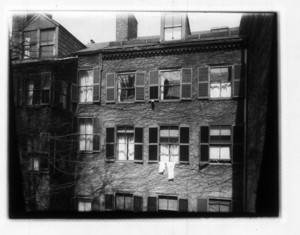 View of the top two stories and the roof of a building