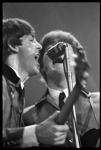 Paul McCartney and John Lennon harmonizing in concert with the Beatles, Washington Coliseum