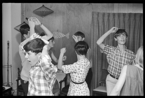 Teenage long hair: boys combing their hair while dancing with girls