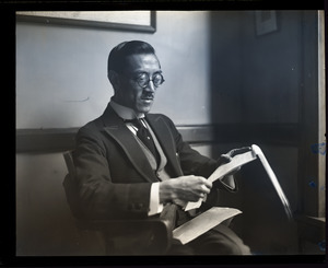 Tehyi Hsieh, the "Teddy Roosevelt of China": portrait seated, reading