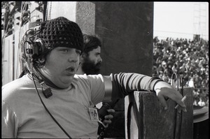 Hollywood Speedway Rock Festival: roadie with headset and cigarette, looking over the crowd