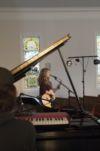 Dar Williams, on guitar during sound check at the First Congregational Church in Wellfleet (Bryn Roberts accompanying on piano)
