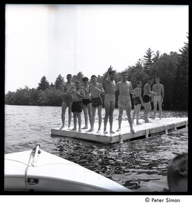 Camp Arcadia: campers on a floating dock in the lake