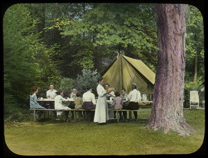 Waugh family at a picnic table while camping