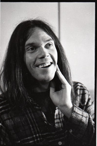 Neil Young laughing backstage at the Music Hall