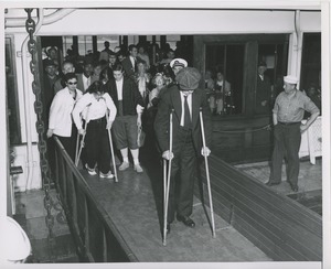 People disembark from ship