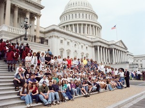Congressman John W. Olver with large group of visitors, posed on the steps of the United States Capitol building