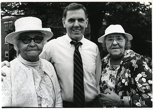 Mayor Raymond L. Flynn with two unidentified women wearing hats