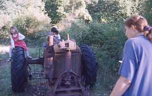 Hopkins Forest Fall Festival, 1999. 15. Children play on old tractor at entrance to the Hopkins Forest Fall Festival.