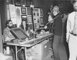 Stephen Baird, a famous street singer who was one of the first to sing on Boston Common, performs at a Suffolk University craft fair, photograph, 1973
