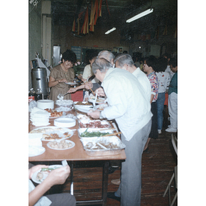 Guests and food at a Chinese Progressive Association anniversary event