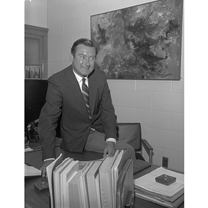 Dean Kenneth Ballou, Dean of University College, sitting in his office