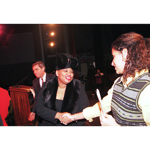 Two women shake hands at the Dr. Martin Luther King Jr. Convocation