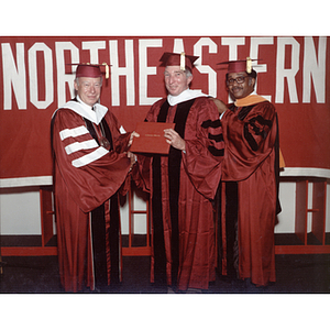 Honorary Degree Recipient John H. Updike with President Ryder and Kenneth A. Loftman