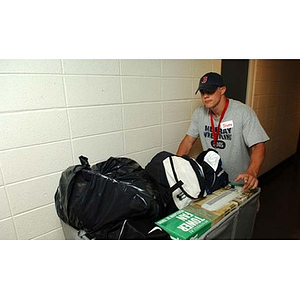 Joseph Bordieri moves a cart of his things into Stetson West