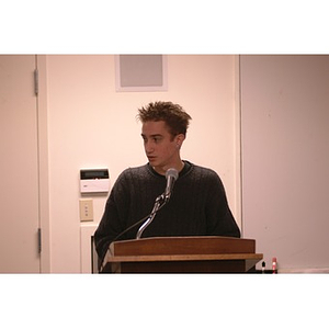 A young man addressing the Student Senate during a meeting