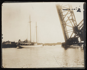 A yacht passes beneath the railroad drawbridge on the Cape Cod Canal