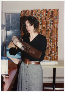 Low-input Sustainable Agriculture (LISA) seminar: unidentified woman, polishing boots
