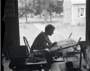 Vida Lindo Guiterman, working at a drafting table