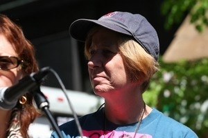 Cindy Sheehan listening to a speaker at the march opposing the war in Iraq