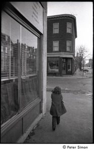Young girl walking up Harvard Street near intersection with Columbia, Cambridge, Mass.