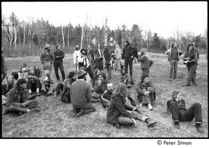 May Day at Packer Corners commune: group sitting and standing in a field